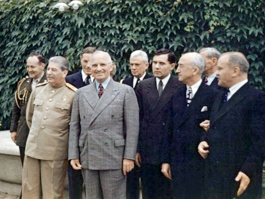 Truman and Stalin standing next to each other.
