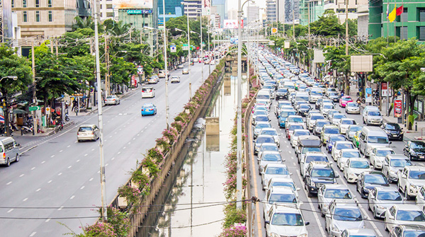 one street is almost empty, the other street is packed with traffic