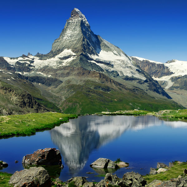 The Matterhorn is on the border between Switzerland and Italy. It is more than 14,500 feet high, making it one of the highest peaks in Europe. The mountain is almost a perfectly symmetrical pyramidal peak, which a sharply pointed mountain peak formed by glacial erosion.