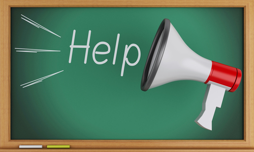 Help written on blackboard with Megaphone.