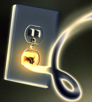 Glowing Electrical Plug in an Electrical Outlet