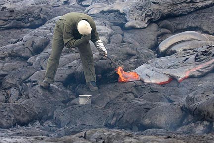 Geologist samples lave from Kilauea volcano on Hawaii.