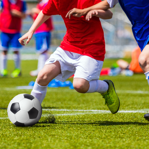 Soccer player kicking ball