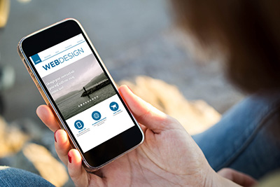 woman looking at mobile-friendly web page on her phone