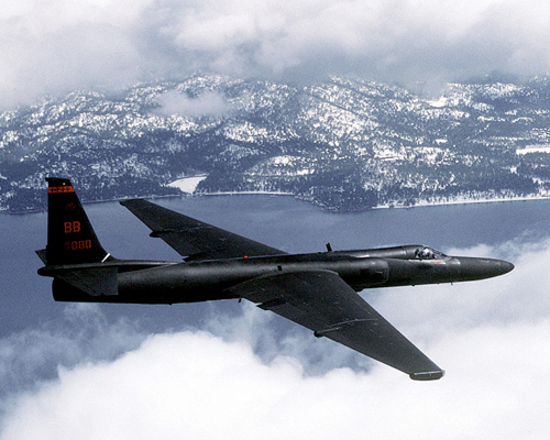 Spy plane flying over mountains.