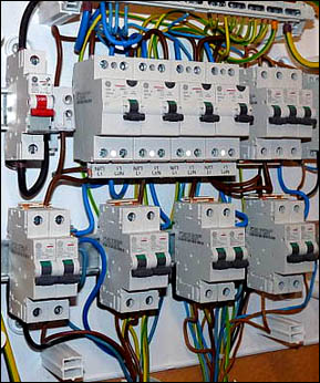 Circuit breakers are being connected to a circuit breaker box