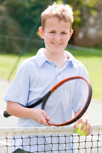 Boy Playing Tennis