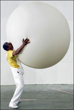Man holding a huge balloon