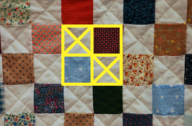 pattern of squares and triangles that completely cover the quilt
