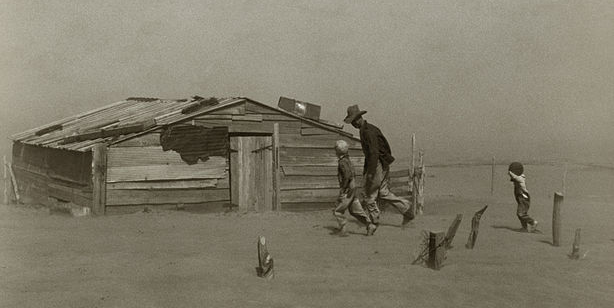 Farmer walking in dust storm Cimarron County Oklahoma.