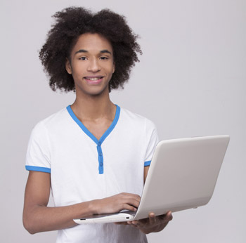 student holding laptop
