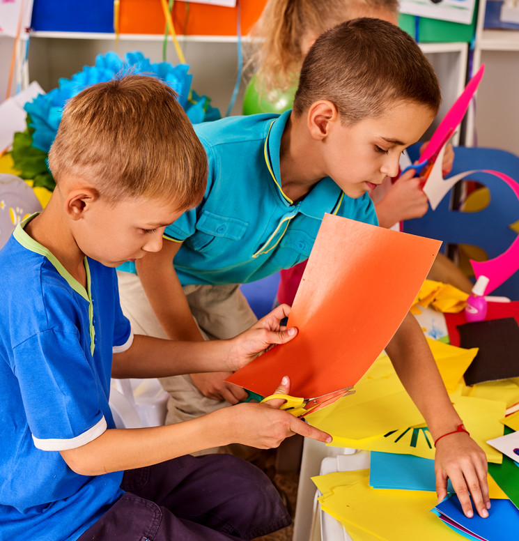 Kids cutting colored paper