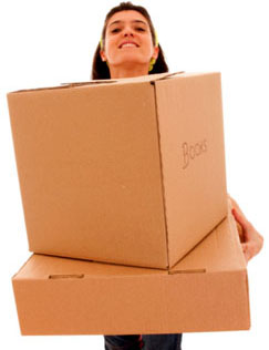 Girl lifting boxes during a house move