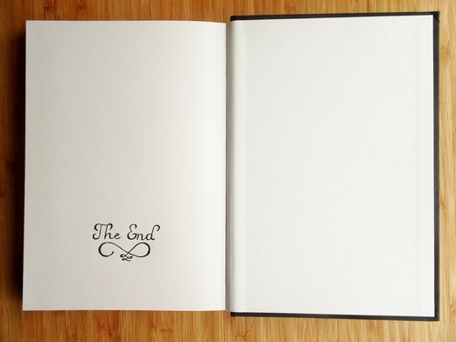 The End / A sketchbook opened on the last page with The End written by pencil.