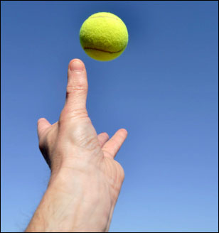 Serving a tennis ball close-up Serving a tennis ball close-up