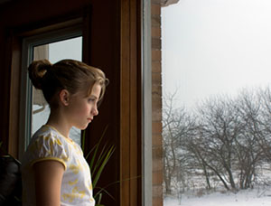 Girl Sitting at Window