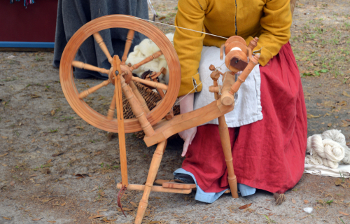 colonial woman spinning yarn