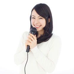 young woman holding a microphone