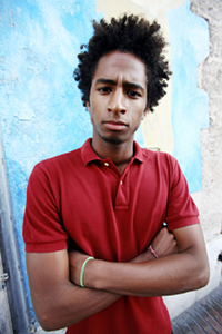 Boy standing near a wall