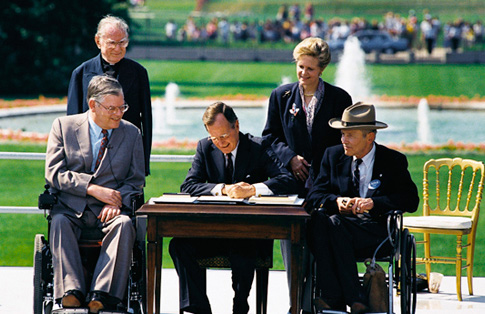 Bush signs in ADA of 1990