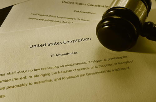 Text of the First Amendment of the US Constitution and court gavel