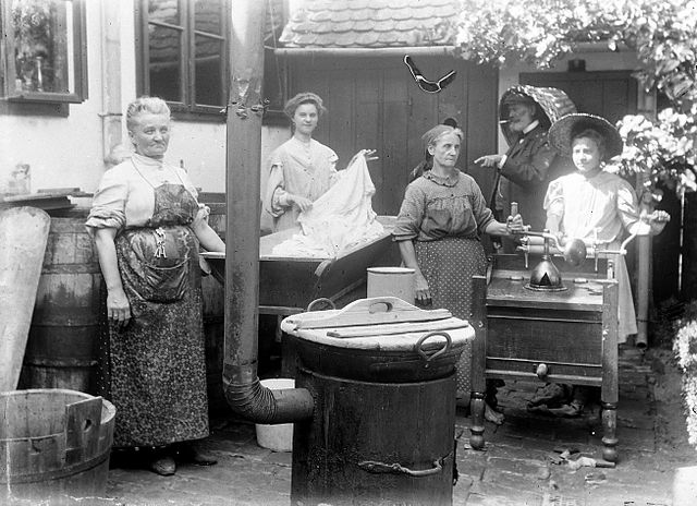 Women near a washing tub