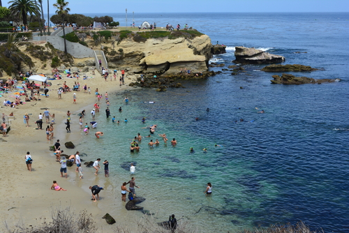LA JOLLA, CA - AUGUST 3: Beachgoers enjoying a beautiful, sunny afternoon at La Jolla Cove in San Diego, CA on August 3, 2013.