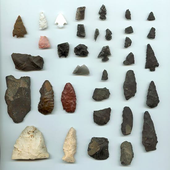 An assortment of Native American artifacts. The two white points on the bottom left were found in Illinois; all others were found in the Reno, Nevada area.