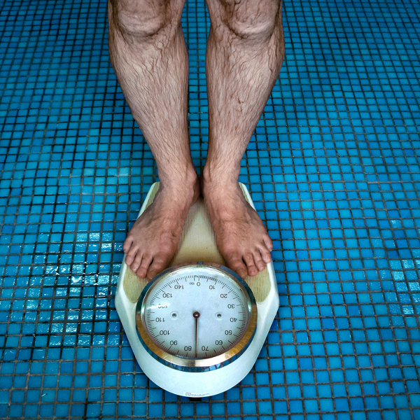 Man on scale: Enter key opens full-screen view with caption; escape key exits full screen.