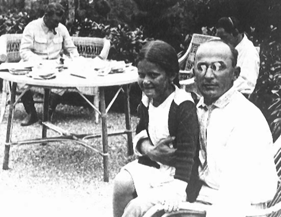 Lavrentiy Beria sitting with a young girl.