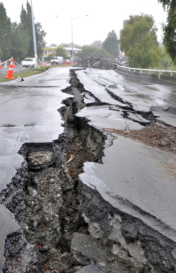 a cracked road surface from an earthquake