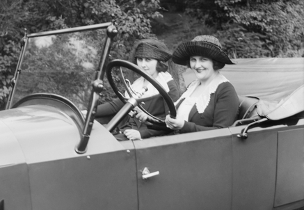 Young women driving a convertible in Washington, D.C. Ca. 1920.