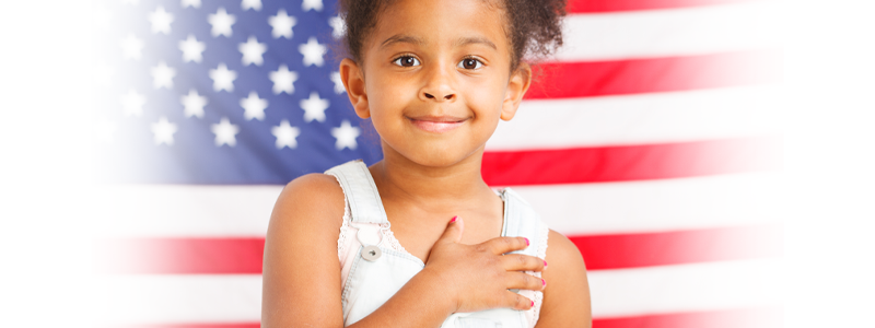 African-American little girl with American flag on a background