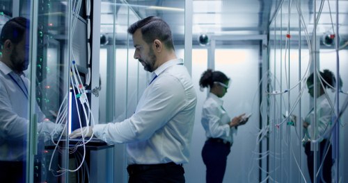 Image of engineers working in a data center.
