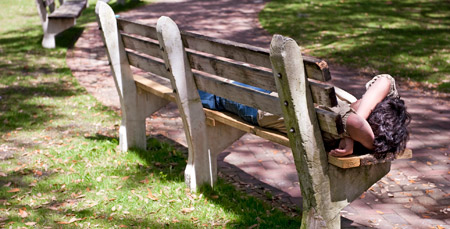 student sleeping on bench