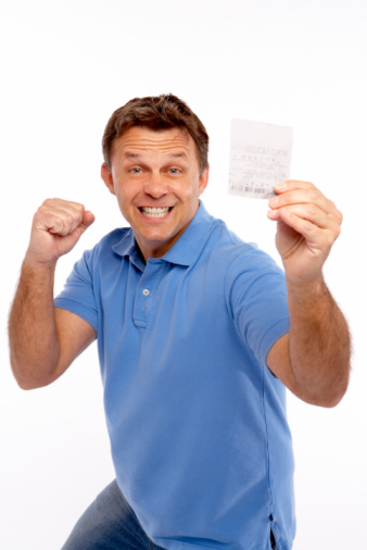 Man holding lottery ticket.