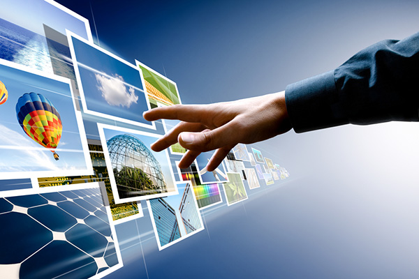 hand reaching out to a stream of images