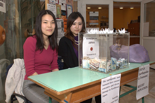 Two Japanese women raising money for donations.
