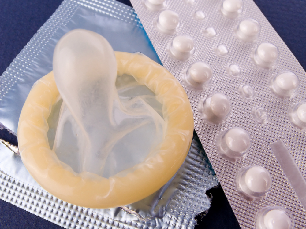 Photo of condom and birth control pills
