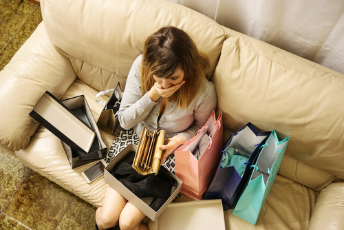 shopping addicted young woman spend too much money worried with empty wallet