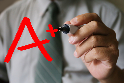 businessman hand write A plus grade,business, technology, internet and networking concept