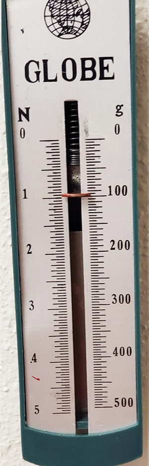 Scale A measuring 1 N