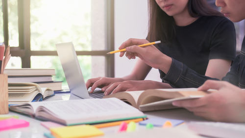 Students on a laptop at home.