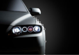 An image of a sports car with a path selecting its edge.