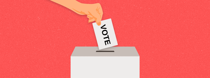 Hand puts voting ballot in ballot box. Voting and election concept. Make a choice image.