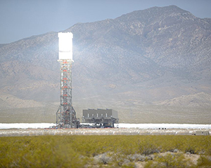 Light reflecting on a solar power collection tower. - Photo by Aioannides via Wikipedia CC BY-SA 3.0