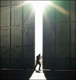 Man pushing a hanger door open
