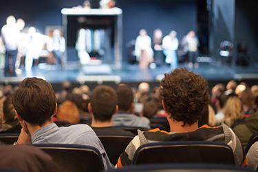 audience watching a play