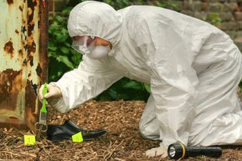 forensics worker wearing safety equipment