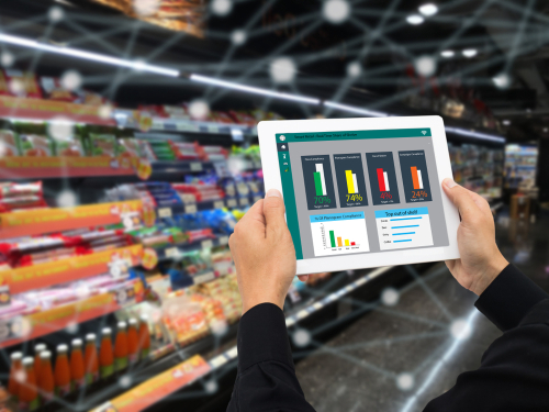 retailer holding tablet and using augmented reality technology monitor data of out of shelve